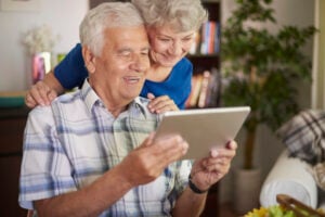 senior couple with a tablet